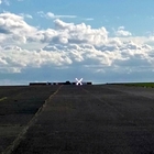 Portable lighted runway closure marker